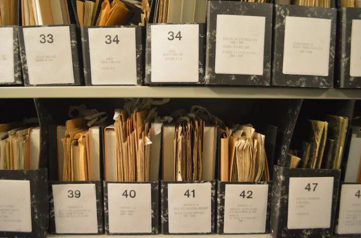 Rows of early-20th-century ICRC records held in archival storage